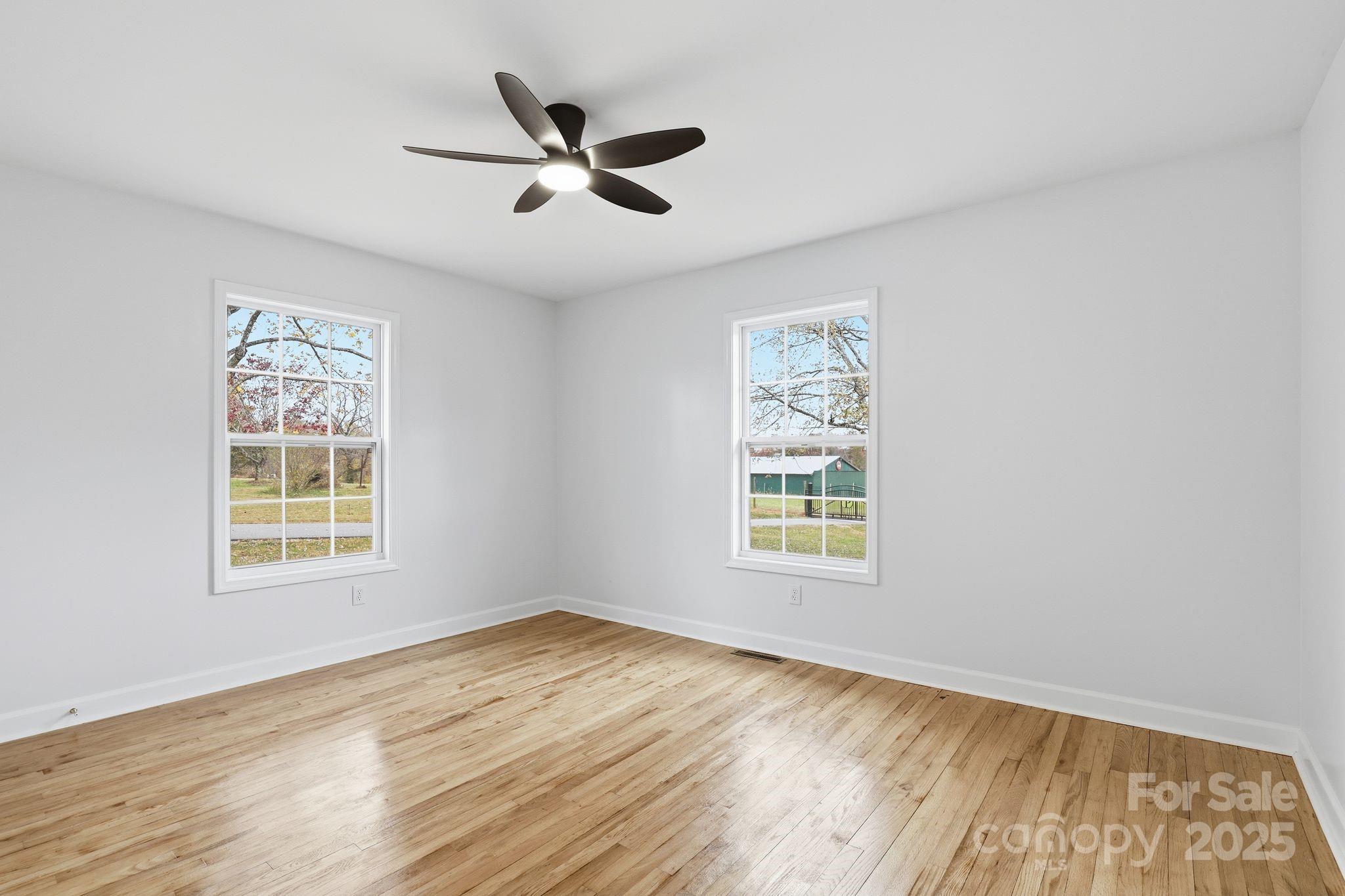 1618 Union Grove Road Lenoir, NC 28645 - Photo 11 of 24 a view of a big room with wooden floor and windows
