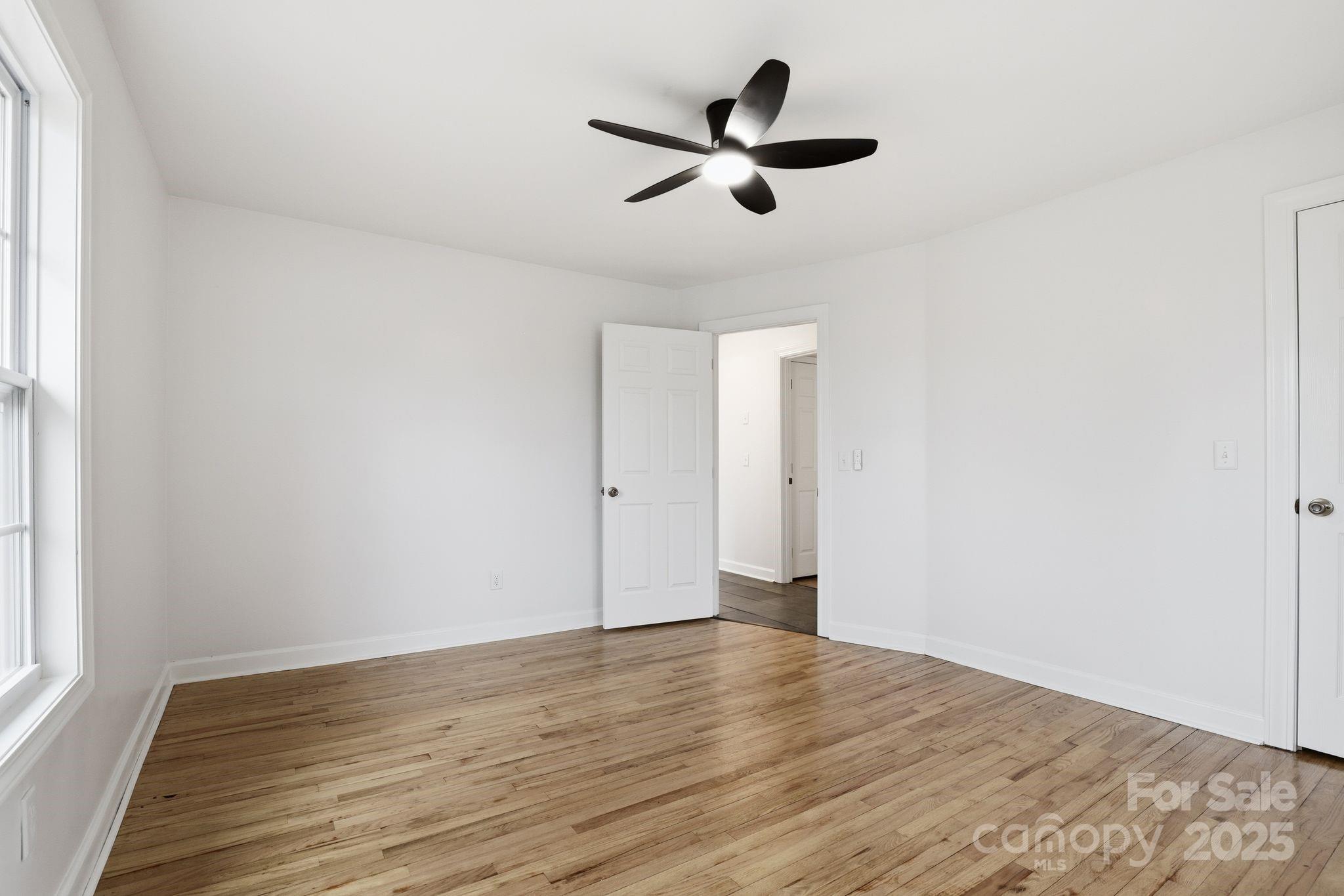 1618 Union Grove Road Lenoir, NC 28645 - Photo 12 of 24 a view of a big room with wooden floor and windows