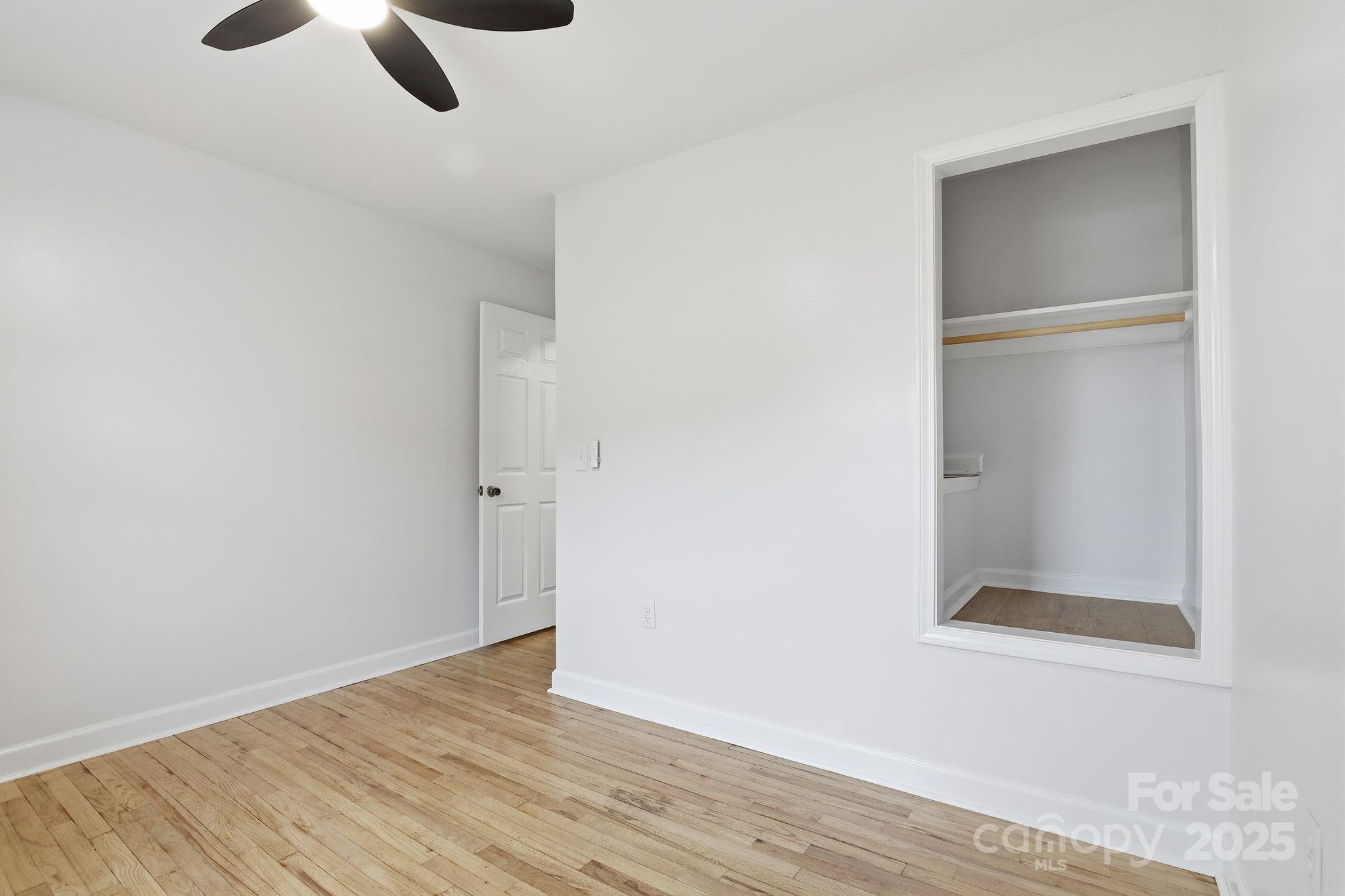 1618 Union Grove Road Lenoir, NC 28645 - Photo 15 of 24 an empty room with wooden floor closet and windows