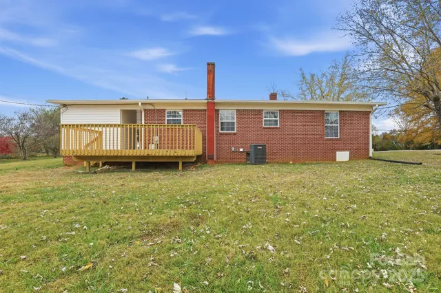 a view of a house with a yard and garage