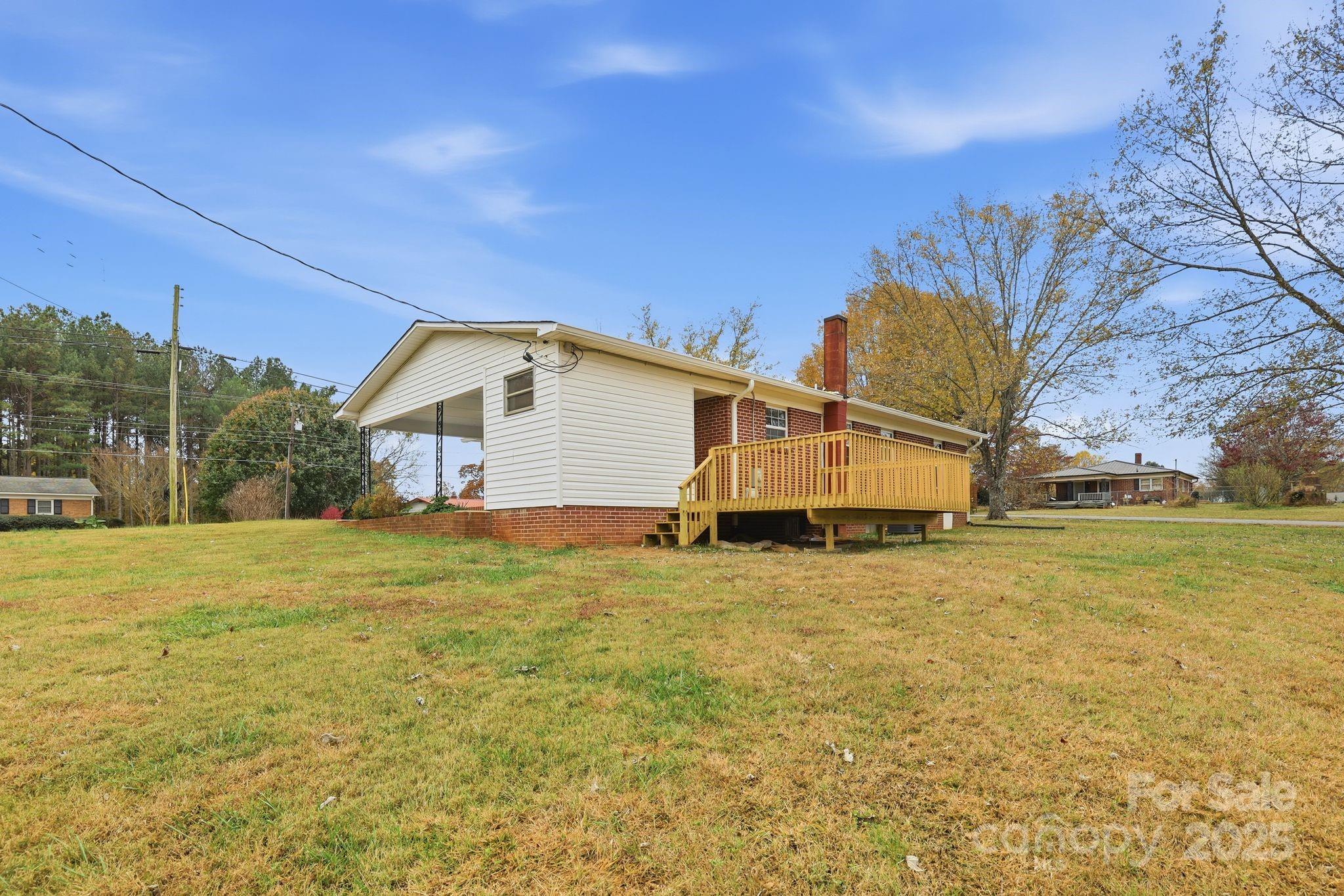 1618 Union Grove Road Lenoir, NC 28645 - Photo 22 of 24 a view of a house with a yard and garage