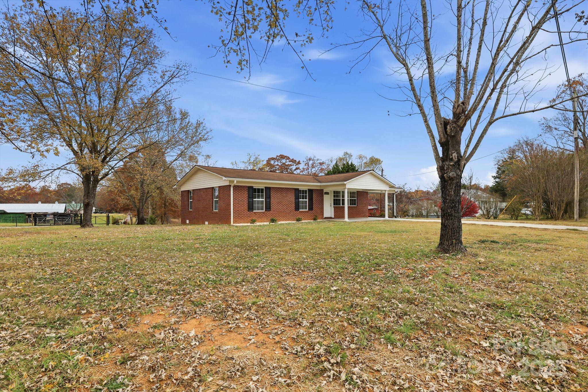 1618 Union Grove Road Lenoir, NC 28645 - Photo 3 of 24 a front view of a house with a yard