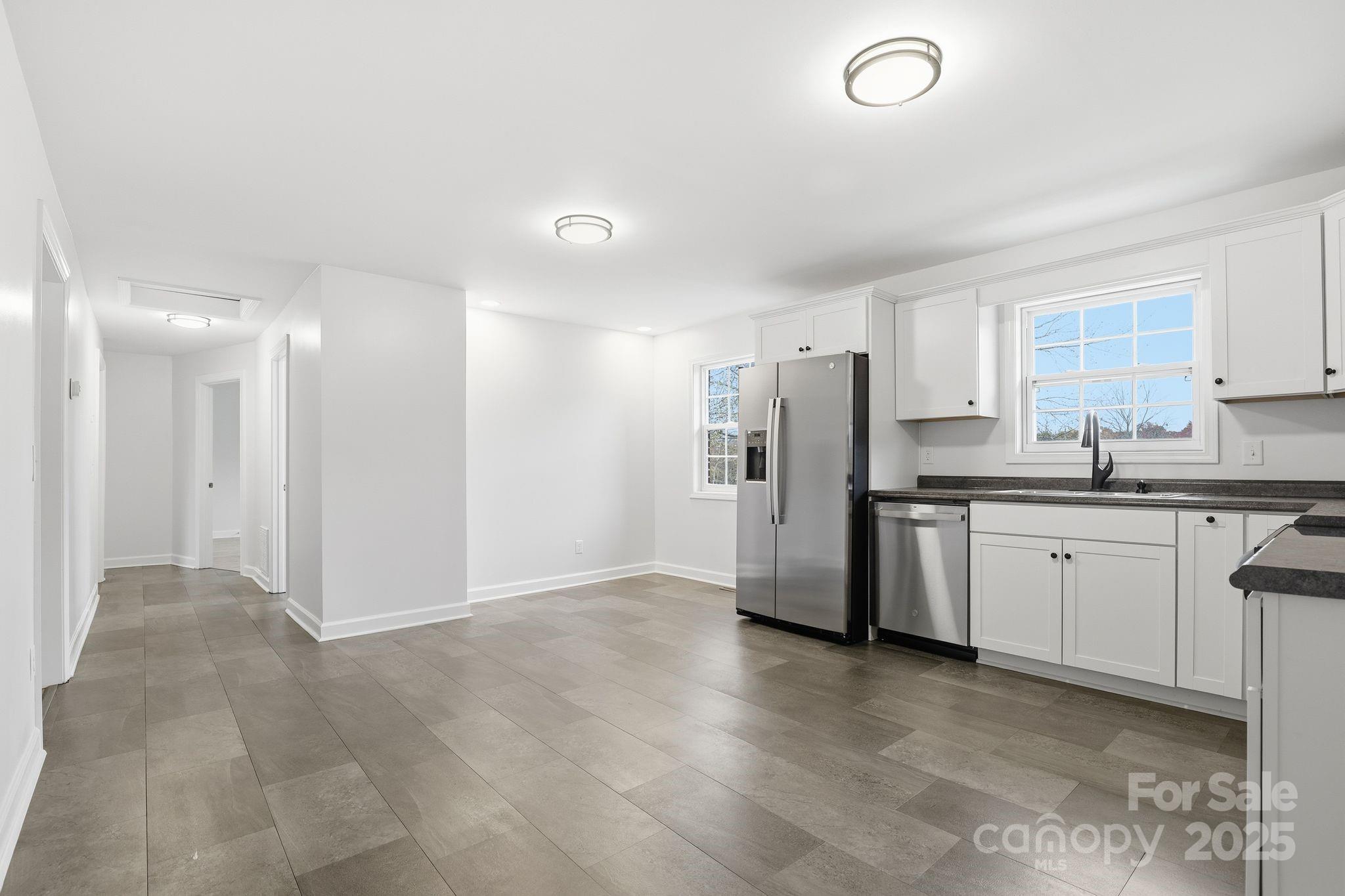 1618 Union Grove Road Lenoir, NC 28645 - Photo 9 of 24 a kitchen with refrigerator and cabinets