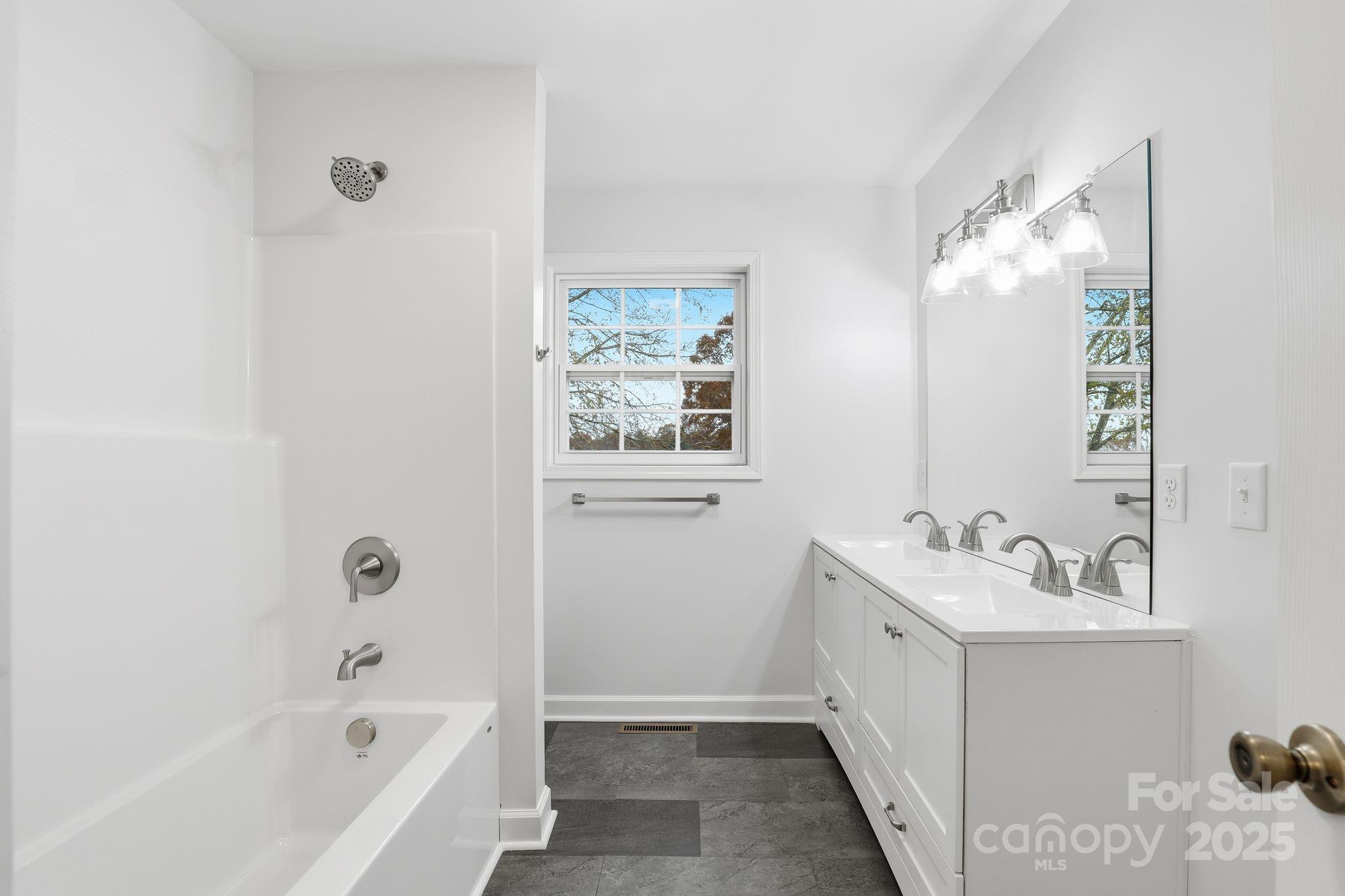 1618 Union Grove Road Lenoir, NC 28645 - Photo 10 of 24 a bathroom with a tub sink and mirror