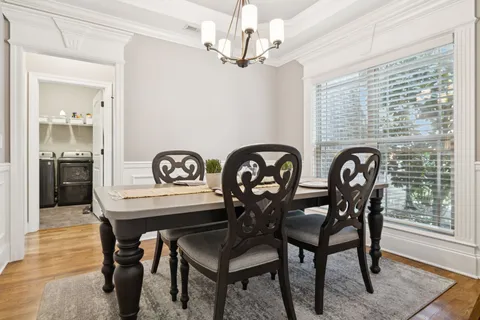 a spacious bedroom with a bed and a flat screen tv