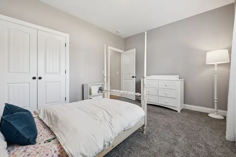 a spacious bathroom with a tub sink and mirror
