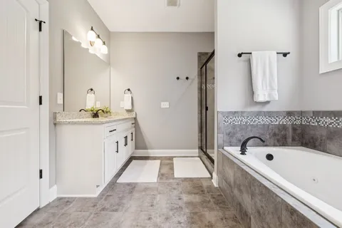 a view of a house with a yard and garage