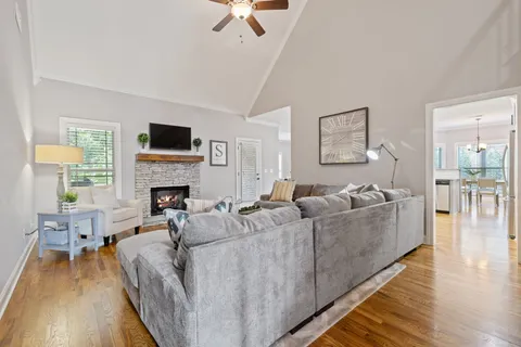 a living room with furniture and a rug