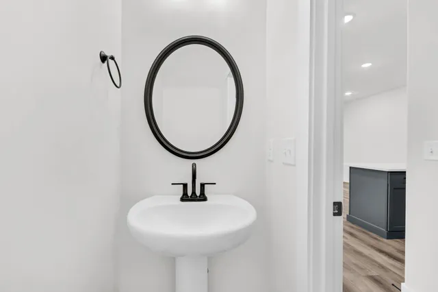 a bathroom with a sink and a mirror