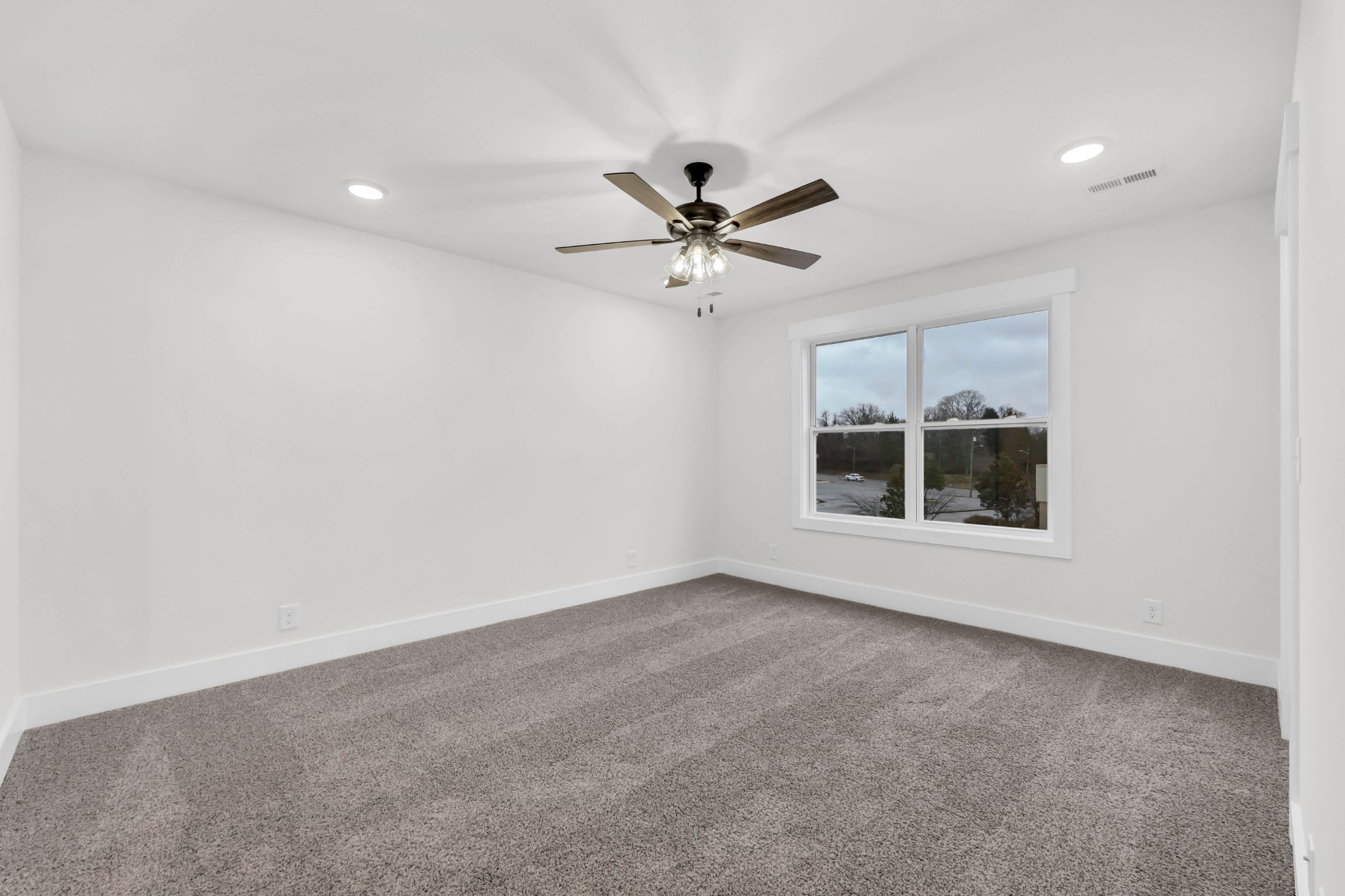 180 Clay Ridge Drive, Unit A4 Clarksville, TN 37040 - Photo 13 of 26 an empty room with a empty space and a ceiling fan