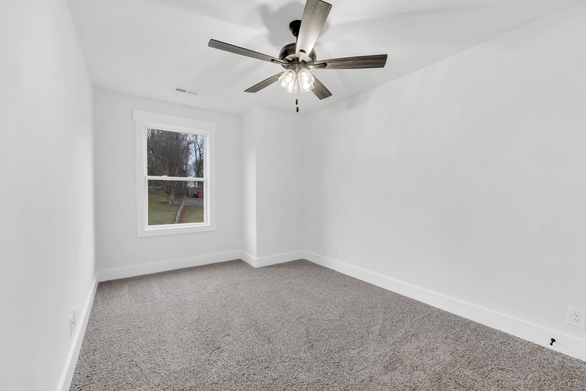 180 Clay Ridge Drive, Unit A4 Clarksville, TN 37040 - Photo 20 of 26 an empty room with windows and fan