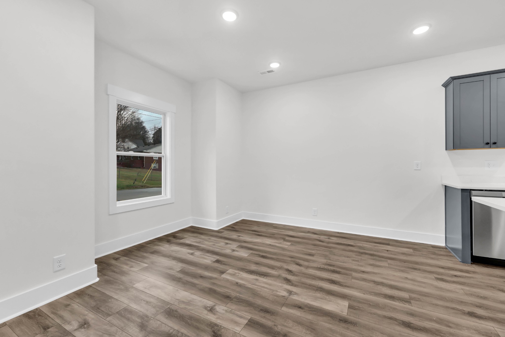 180 Clay Ridge Drive, Unit A4 Clarksville, TN 37040 - Photo 5 of 26 a view of an empty room with wooden floor and a window