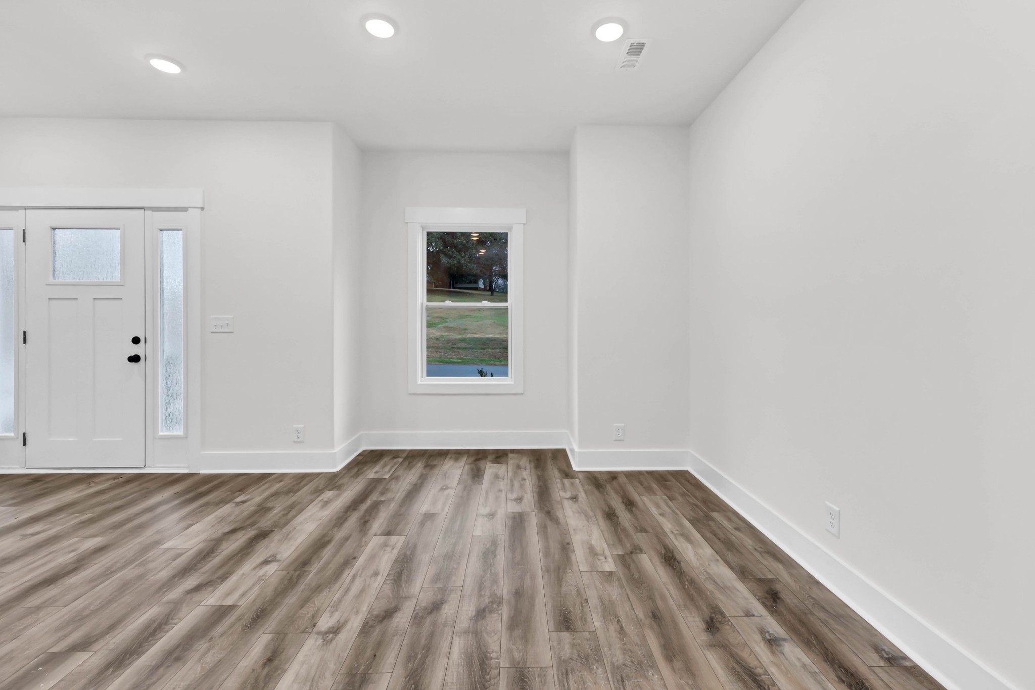 180 Clay Ridge Drive, Unit A4 Clarksville, TN 37040 - Photo 6 of 26 a view of room with window and hardwood floor