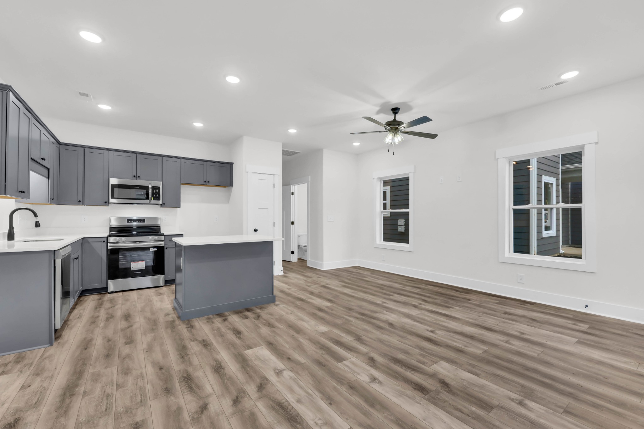 180 Clay Ridge Drive, Unit A4 Clarksville, TN 37040 - Photo 7 of 26 a large kitchen with kitchen island a sink dishwasher stove and refrigerator