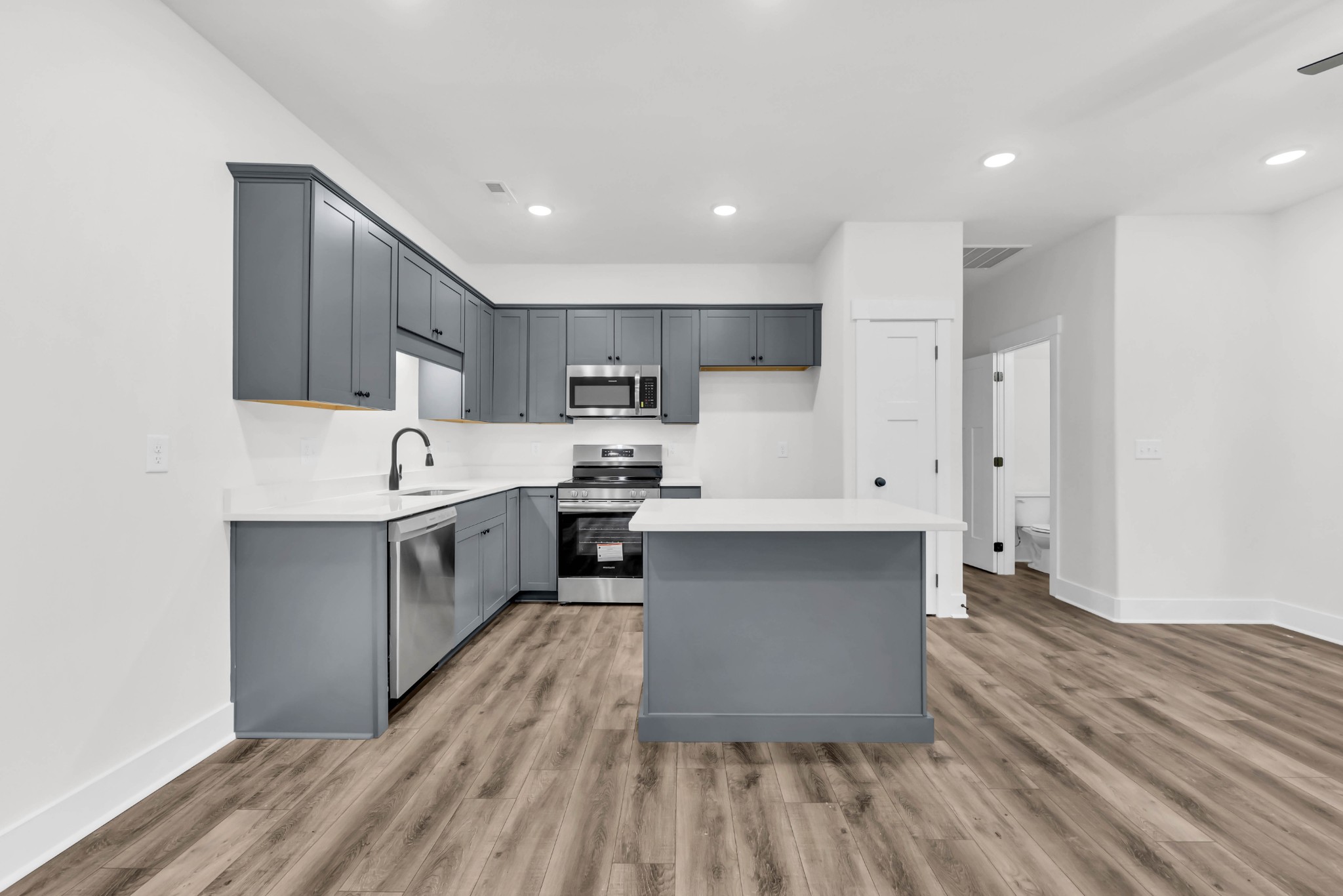 180 Clay Ridge Drive, Unit A4 Clarksville, TN 37040 - Photo 8 of 26 a kitchen with stainless steel appliances a refrigerator sink and cabinets