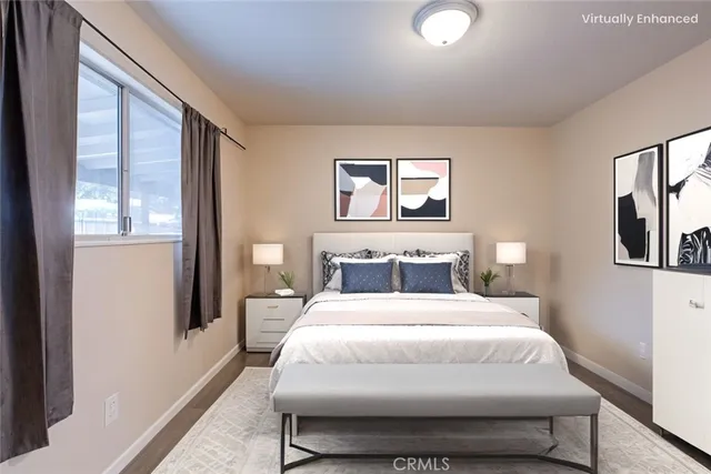 a bedroom with a bed and glass windows