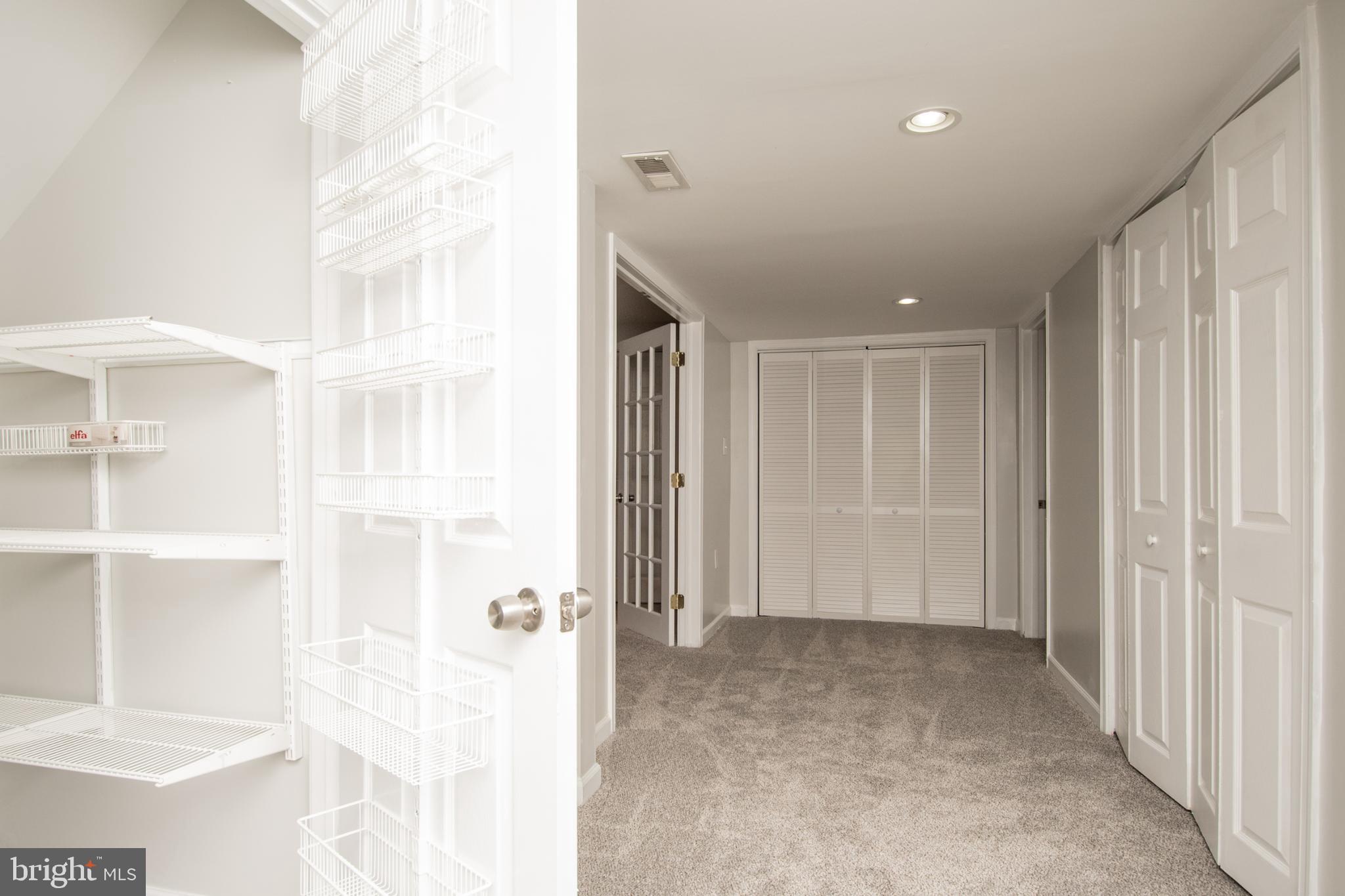 1609 Thomas Road Fort Washington, MD 20744 - Photo 19 of 27 View of lower lvl storage with shelving New carpet