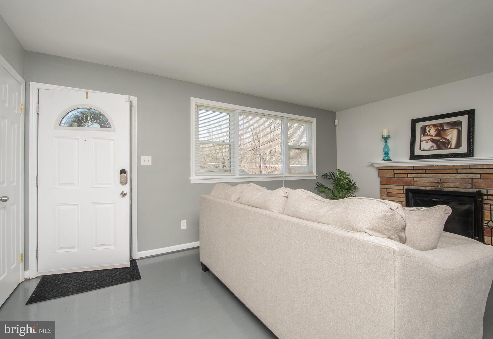 1609 Thomas Road Fort Washington, MD 20744 - Photo 9 of 27 View of Living Room with Wood Burning Fireplace .