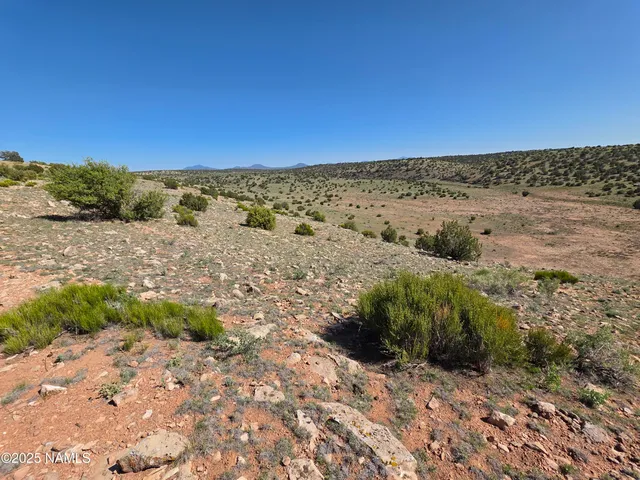 a view of mountains and valleys