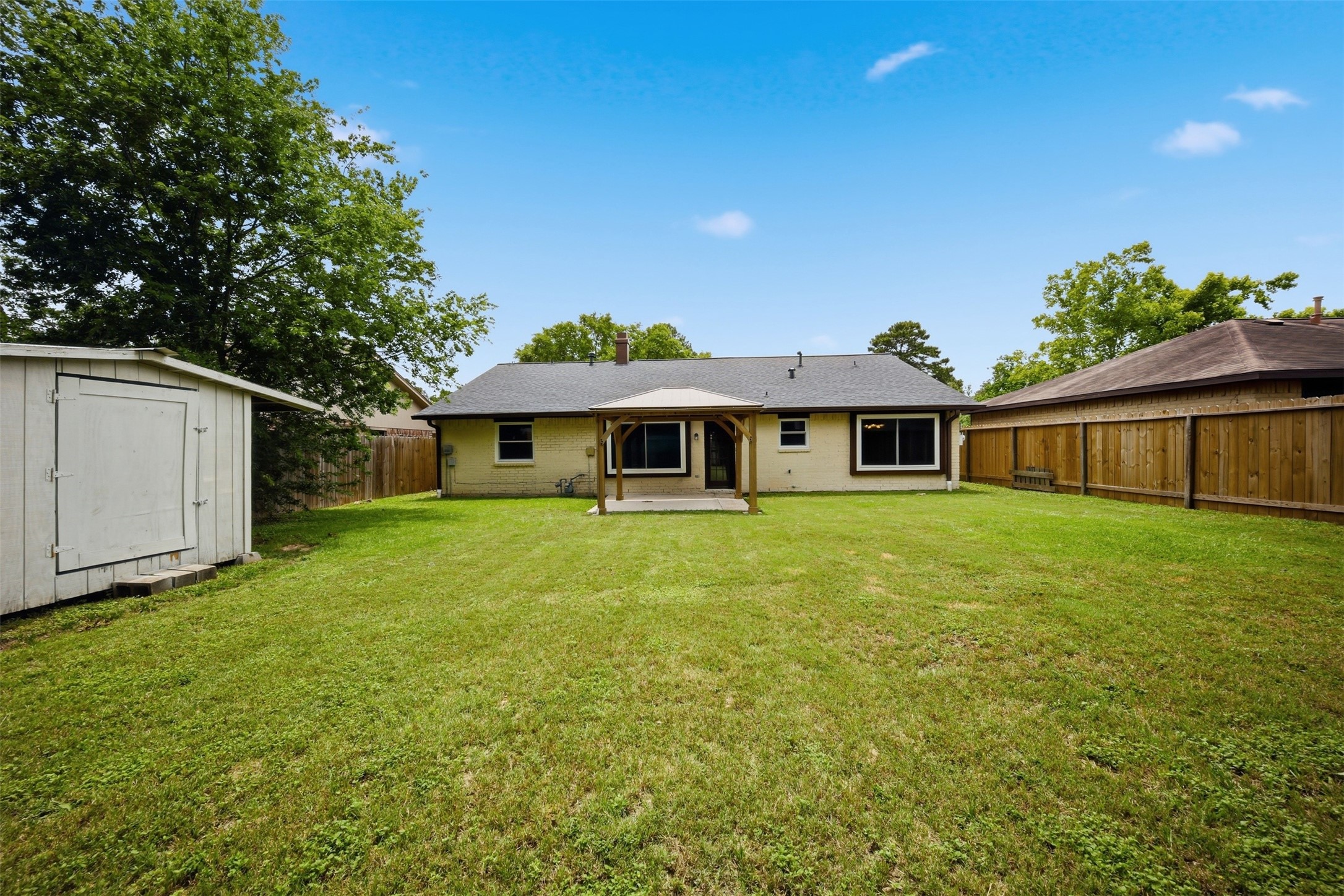 9418 Kilrenny Drive Spring, TX 77379 - Photo 35 of 47 a front view of a house with a garden