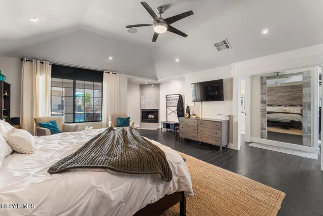 a spacious bedroom with a balcony a bed and a couch