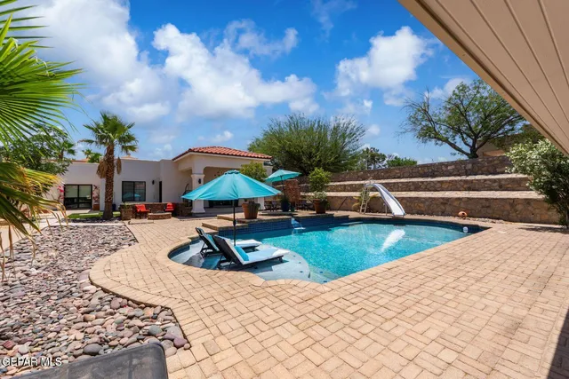 a view of outdoor space with swimming pool
