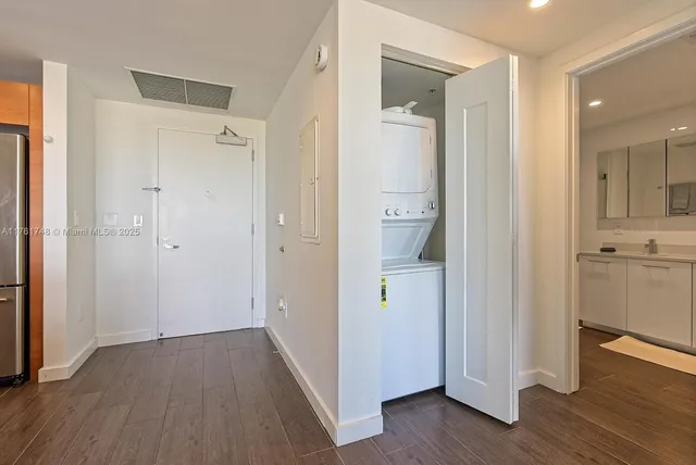 a view of a bathroom with a shower and a sink