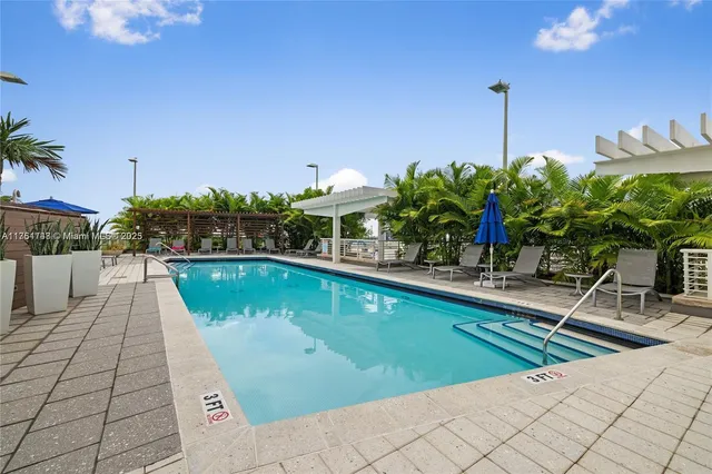 a view of a swimming pool with a lounge chairs