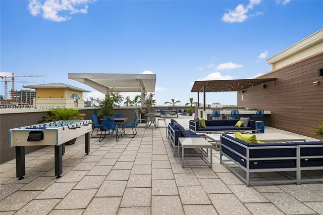 a view of a terrace with sitting area