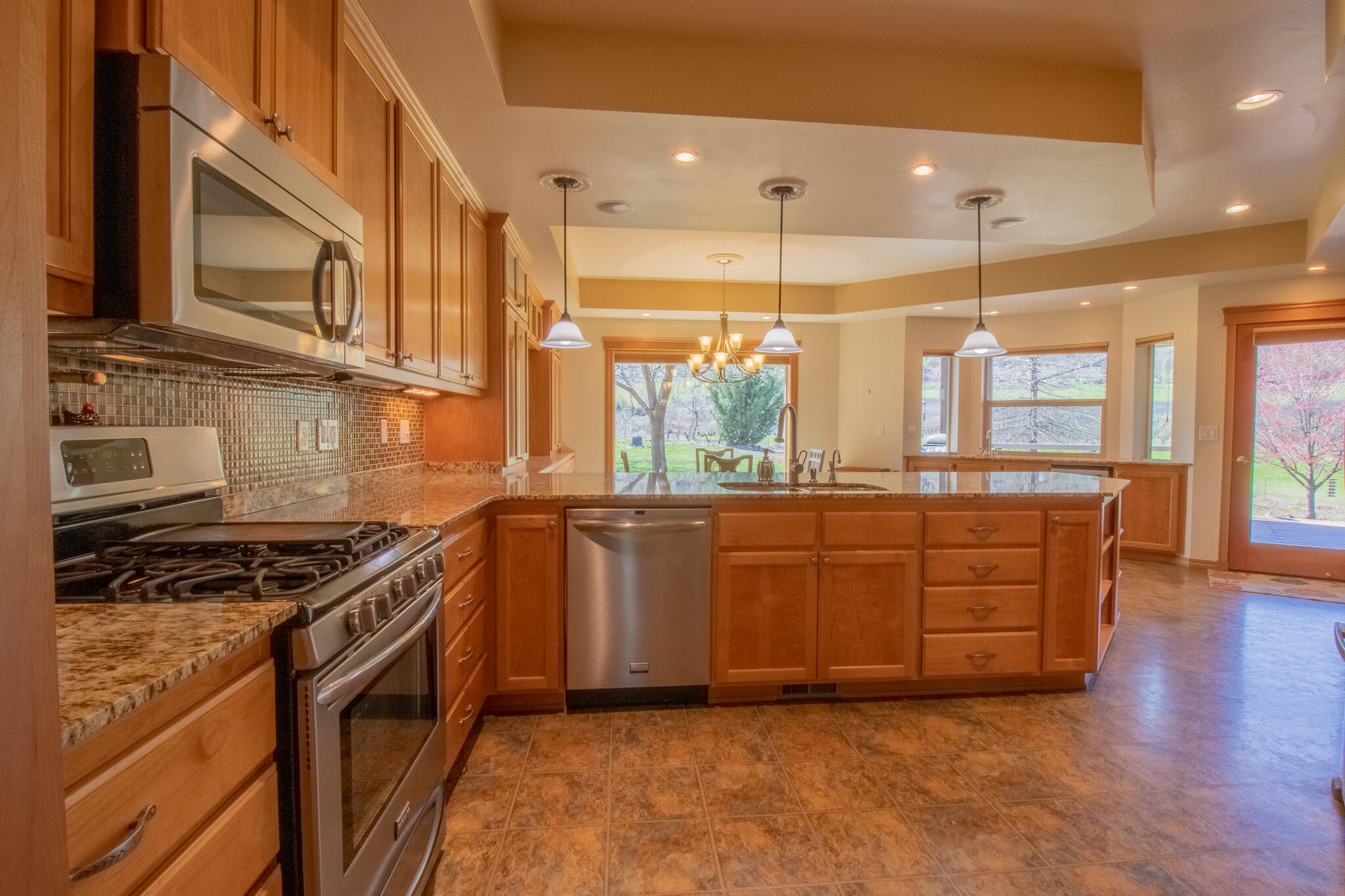 1381 Foss Road Talent, OR 97540 - Photo 10 of 41 Beautiful tile and granite kitchen with loads of cabinetry and built-ins
