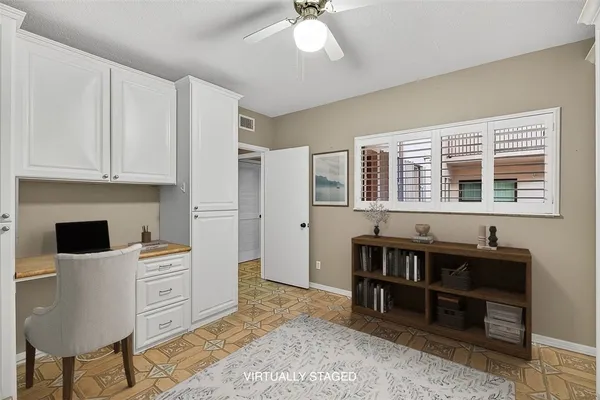 a bathroom with a granite countertop sink a toilet a mirror and shower