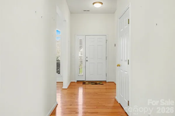 a spacious bathroom with a granite countertop sink a toilet and a shower