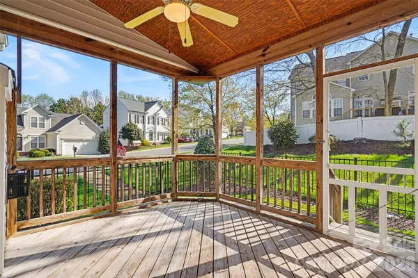 a view of a balcony with wooden floor