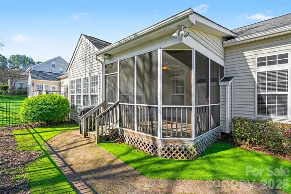 a view of a house with a small yard and a large window