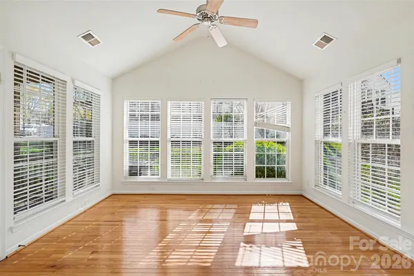a view of empty room with windows