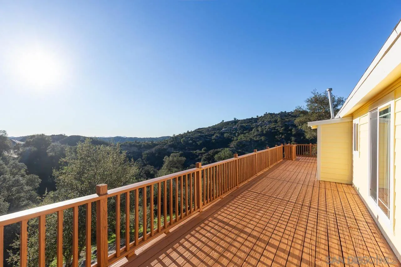1328 Riverwood Road Santa Ysabel, CA 92070 - Photo 17 of 31 a view of a balcony with wooden floor and fence
