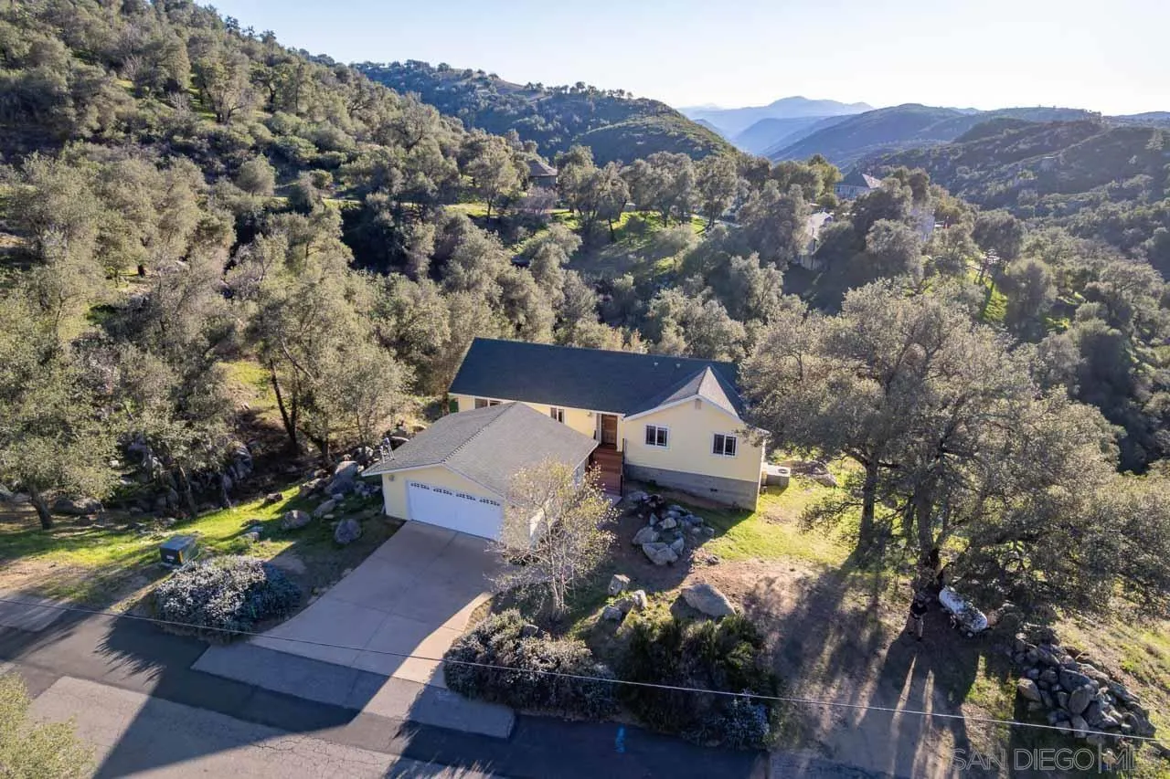 1328 Riverwood Road Santa Ysabel, CA 92070 - Photo 28 of 31 a view of a house with a mountain in the background