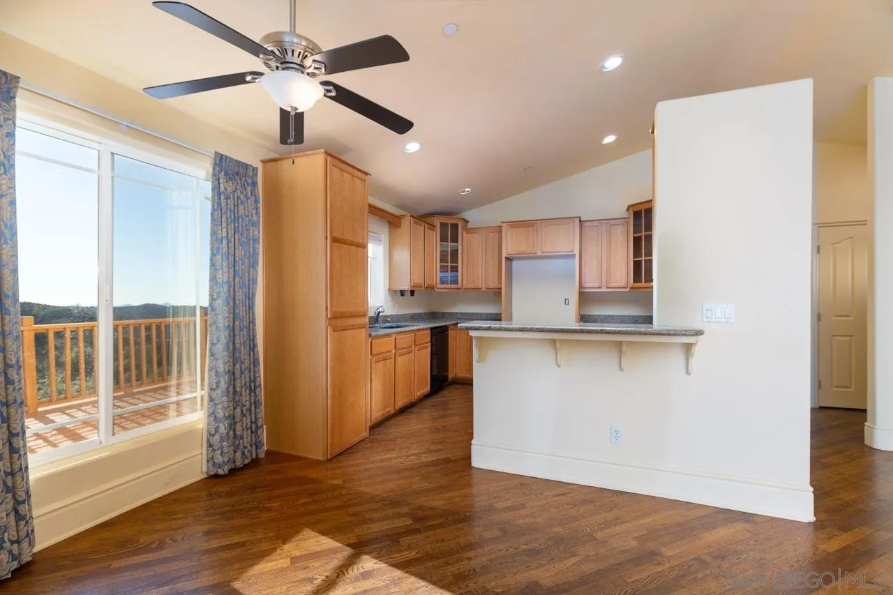 1328 Riverwood Road Santa Ysabel, CA 92070 - Photo 7 of 31 a view of kitchen with stainless steel appliances granite countertop a refrigerator a sink and a stove
