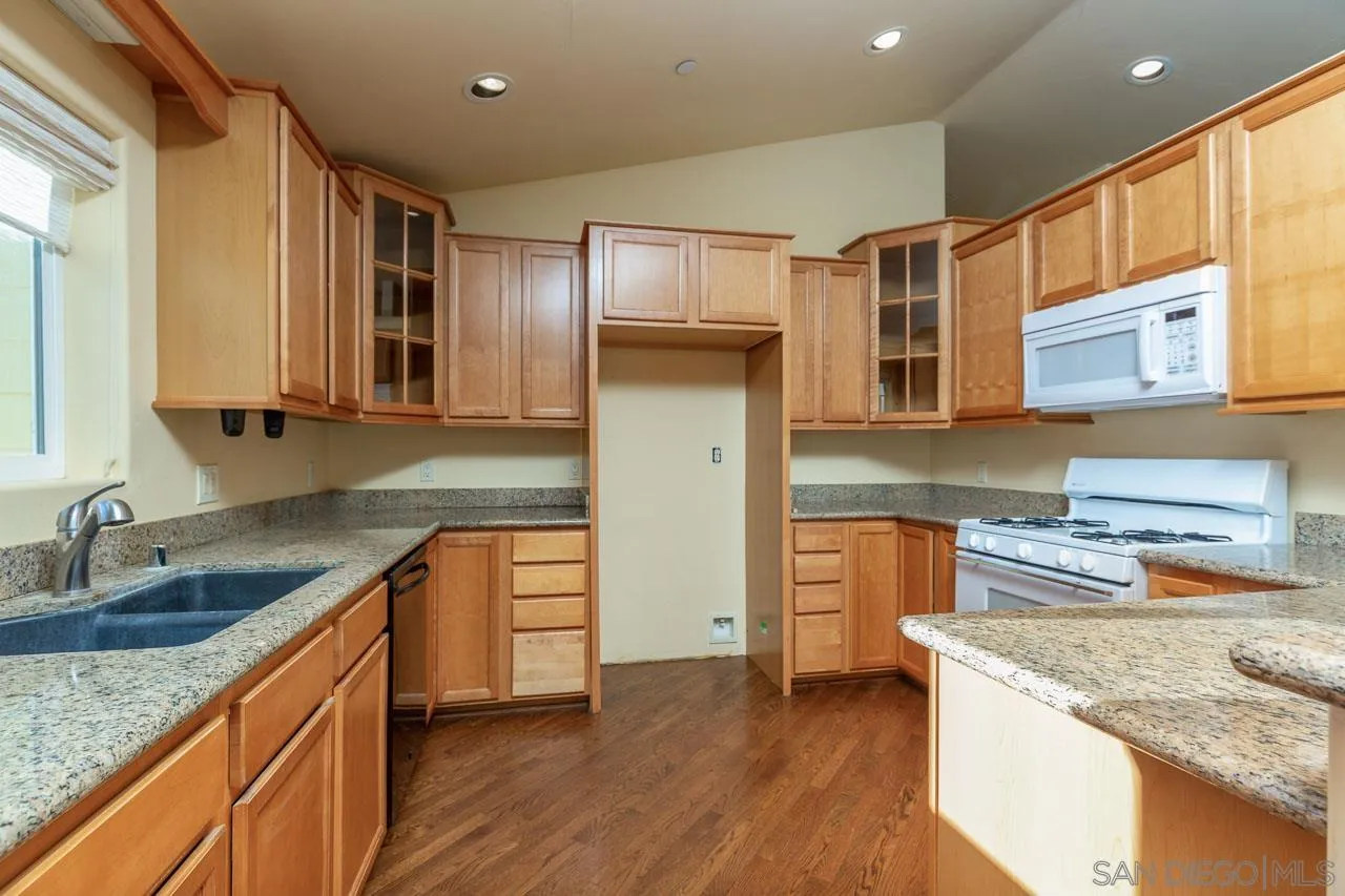 1328 Riverwood Road Santa Ysabel, CA 92070 - Photo 8 of 31 a kitchen with stainless steel appliances granite countertop a sink stove and refrigerator