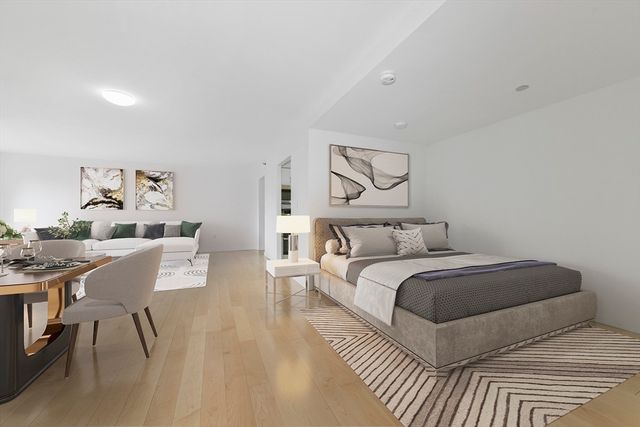 a bedroom with a bed and a table