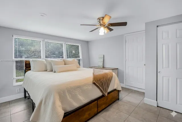 a workspace room with furniture and window