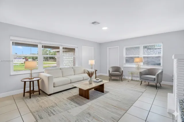 a living room with furniture and a window