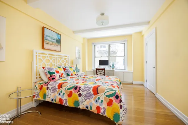 a kitchen with stainless steel appliances a stove and a chandelier