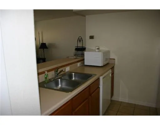 a kitchen with a stove and a refrigerator