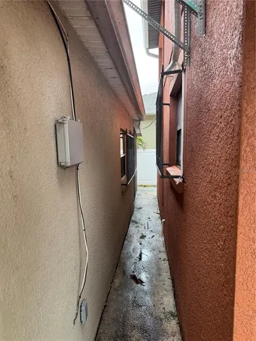 a hallway with front door windows