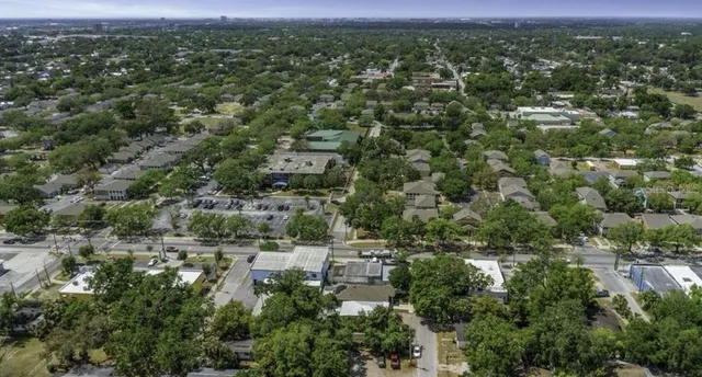an aerial view of a house with outdoor space and street view