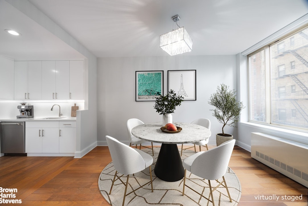 308 East 72nd Street, Unit 3D Manhattan, NY 10021 - Photo 3 of 8 a view of a dining room with furniture and window
