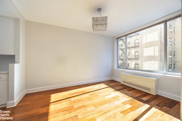 a view of a dining room with furniture and window