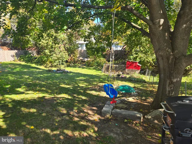 a view of a tree in front of a house