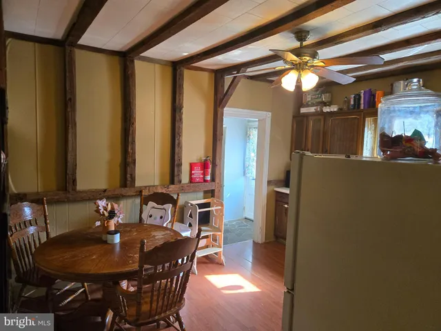 a dining room with furniture and a chandelier